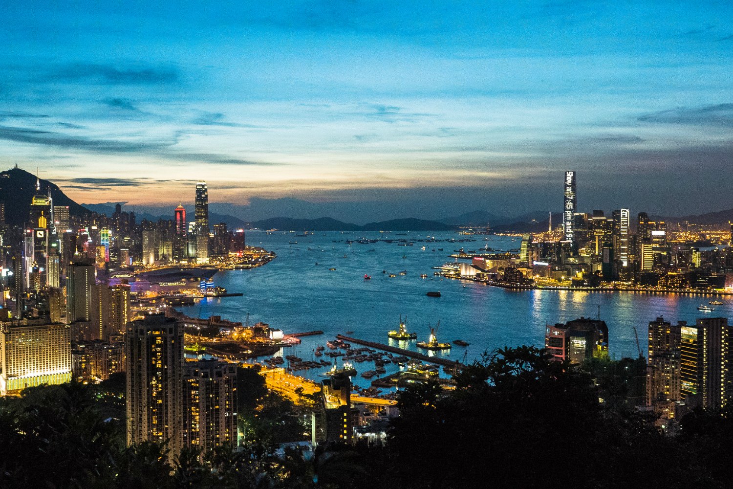 Hong Kong City Lights On Both Sides Of Victoria Harbour